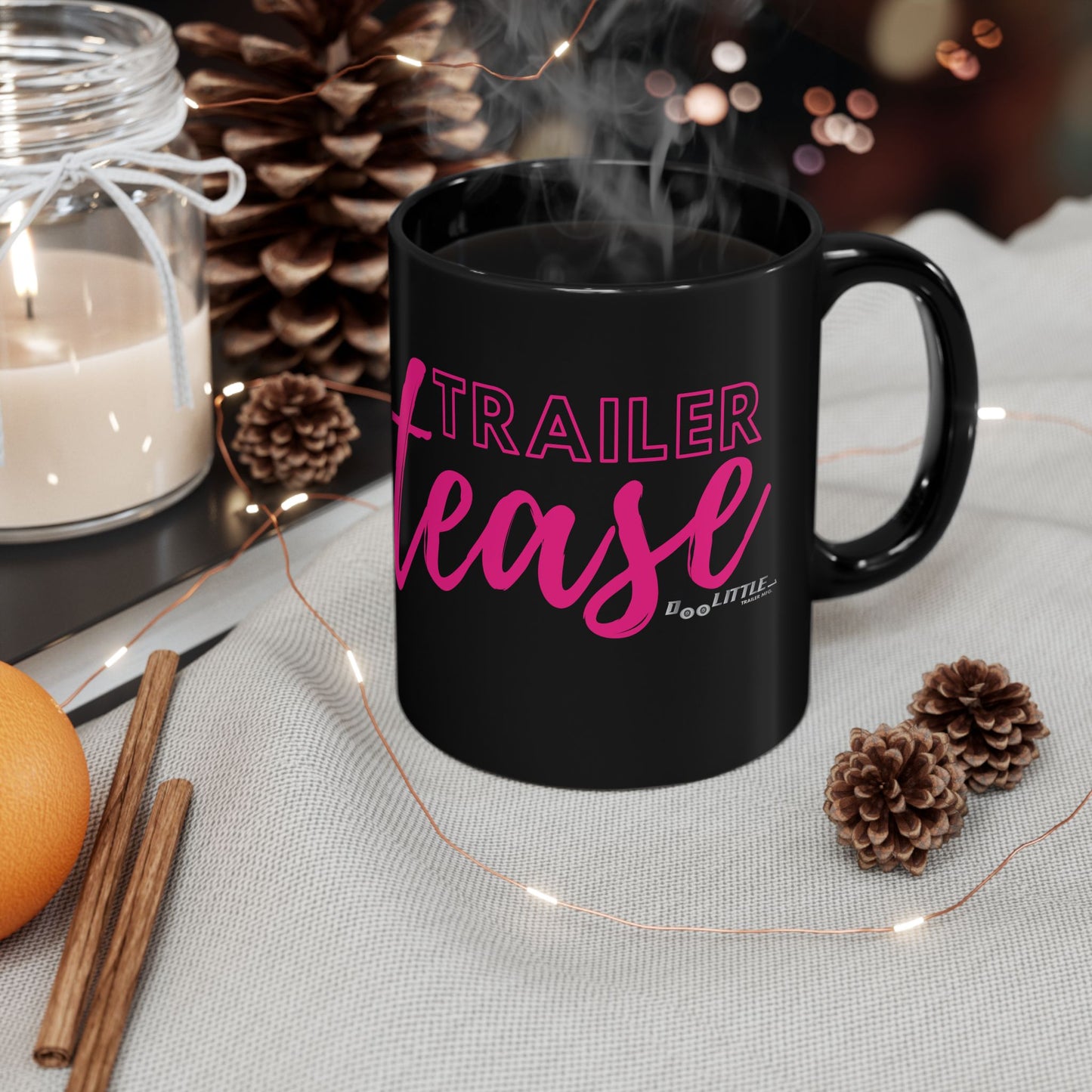 black coffee mug with pink trailer tease logo on it