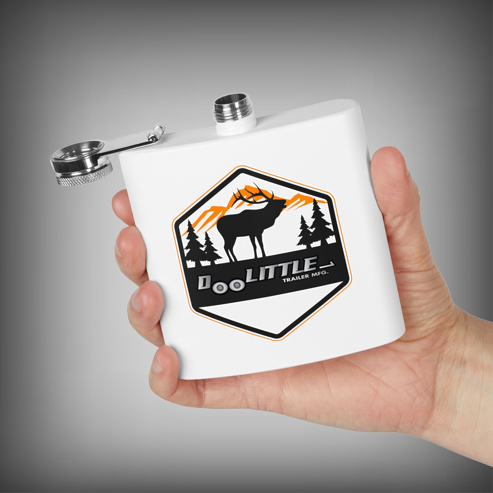 White flask with a logo held in a hand against a gray background